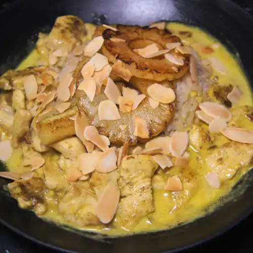 Swiss Riz Casimir with tender chicken, curry sauce, bananas, pineapple, and rice