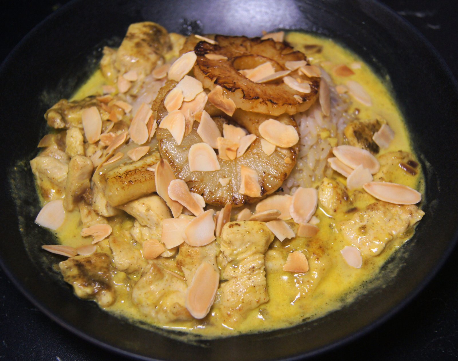 Swiss Riz Casimir with tender chicken, curry sauce, bananas, pineapple, and rice