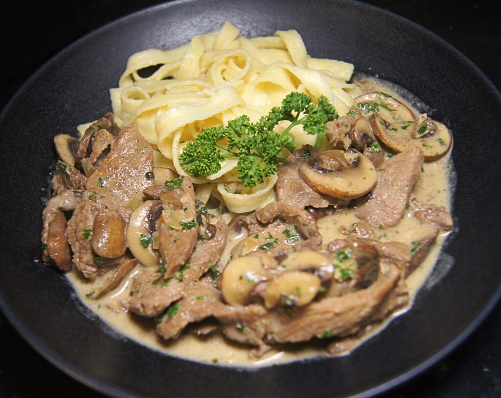 Zurich-style veal with creamy white wine sauce, mushrooms, and spaetzle