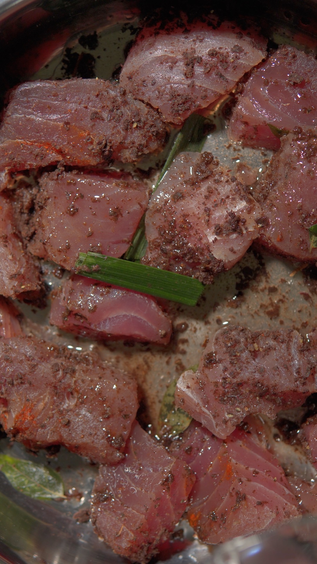 Seasoned tuna ready to cook in the pan